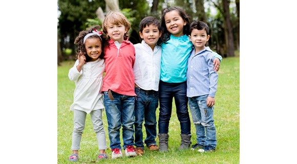 Group of young children mixed races looking at camera